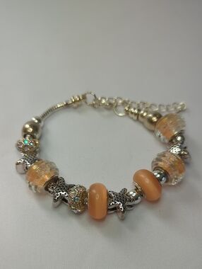 Sterling Plated Charm Bracelet with Peach Glass Beads